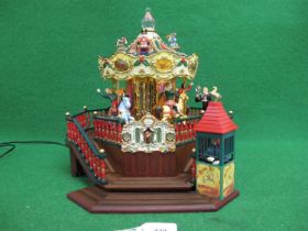 Christmas themed merry-go-round made of plastic in China for Maisto, the mains powered model