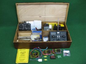 Wooden box containing radio control items to include: hand sets, speed controllers, mini-motors,