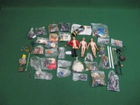 Three different Action Men, Made in England by Palitoy with a large quantity of clothing, weapons,