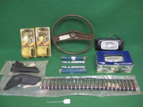 Crate of new old stock Austin Allegro parts to comprise: round steering wheel, front grill, two rear