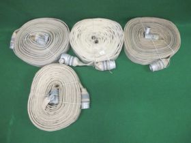 Four fire hoses with couplings, one is stencilled W426927 1955. Last tested/serviced in 1992