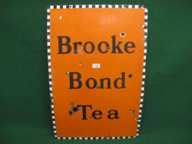 Enamel sign for Brooke Bond Tea, black letters on an orange ground with a black and white border -