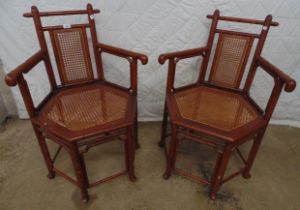 Pair of mahogany faux bamboo open elbow chairs with hexagonal seats Please note descriptions are not