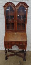 Queen Anne style ladies bureau bookcase having double arched top, two candle slides and fitted