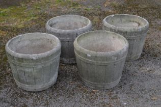 Set of four circular barrel formed planters - 16" tall Please note descriptions are not condition