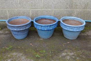 Set of three blue glazed circular planters - 12.25" tall Please note descriptions are not