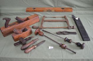 Box containing a quantity of woodworking tools to include: two wood planes, level, two Archimedes