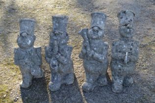 Set of four garden statues of marching band figures approximately 17" tall Please note