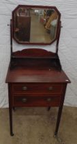 Inlaid mahogany dressing chest having swing mirror over two drawers and standing on square legs