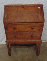 Heals limed oak bureau having fitted interior of pigeon holes, Heals button to top edge of