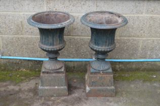 Pair of painted iron fluted garden urns on square plinth bases - 27" tall Please note descriptions