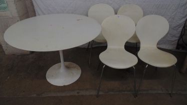 Un-named white circular tulip table - 42" in dia together with a set of four white Stefix chairs