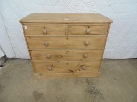 Victorian stripped pine chest of three long graduated and two short drawers with knob handles,