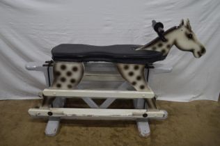 Painted rocking horse with padded seat, standing on wooden stand - 33.5" tall Please note
