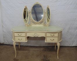 Cream and gilt dressing table with glass top having single frieze drawer flanked by two drawers to