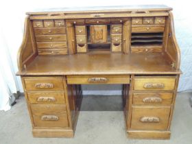 Restored oak roll top desk with new fitted interior of drawers and pigeon holes, one frieze drawer