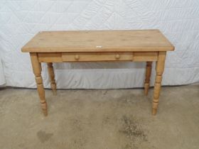 Pine side table with single drawer having knob handles, standing on turned legs - 48" x 20" x 29"