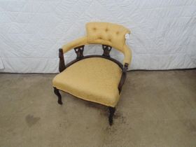 Mahogany framed tub style chair with gold upholstery to seat, arms and back, standing on shaped