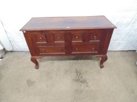 Villa & Hut hardwood sideboard having four small square and two rectangular drawers, standing on