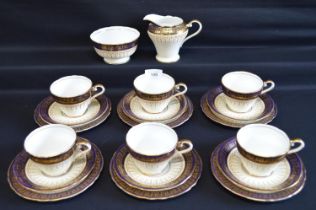 Aynsley tea set having blue border with gilt Greek Key design to comprise: six tea cups, milk jug,
