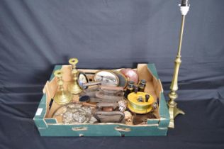 Box of sundry items to include: brass table lamp, candlesticks, flat irons and fishing reel etc