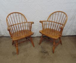 Two modern Windsor style chairs with spindle backs, standing on turned legs and stretchers Please