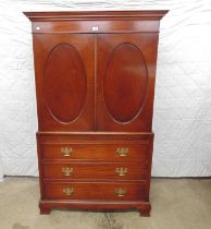 Late 20th century mahogany linen cupboard of two doors over pull out gilt tooled leather writing