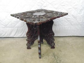 Highly carved square occasional table standing on carved folding X frame - 24.5" x 22" x 23.5"