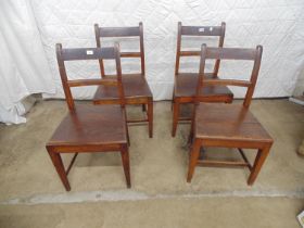 Set of four 19th century oak solid seated chairs with bar backs and tapering legs Please note