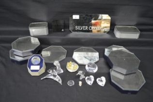 Group of various Swarovski display stands together with 1987 SCS members piece and heart shape box