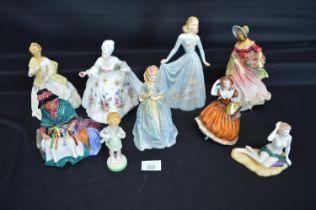 Group of nine porcelain figures to comprise: Royal Doulton Silks & Ribbons HN2017, Royal Doulton