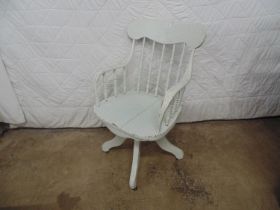 Painted swivel office chair with back and arm spindles, standing on four legs Please note