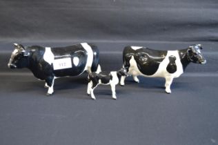 Set of three Beswick Jersey cows to comprise: bull, cow and calf Please note descriptions are not