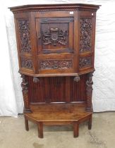 Gothic Revival German Dressoir highly carved with crest, figure heads and foliage. Central door
