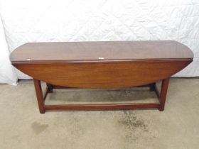 Elliptical mahogany drop flap table standing on a stretchered base - 60" x 36" x 21" tall (open)