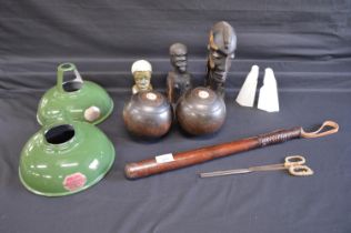 Group of sundry items to include: two tribal carved wooden busts, two bowling woods, truncheon and