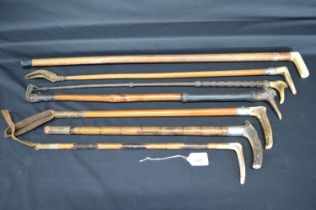 Group of six antler handled riding crops together with a walking stick Please note descriptions