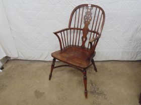 Wheelback Windsor chair standing on turned legs with crinoline stretcher Please note descriptions