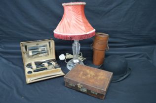 Cut glass table lamp, bowler hat, two leather cases and a fitted vanity case Please note