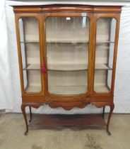 Glazed mahogany inlaid bow fronted display cabinet with single door opening to two shelves over