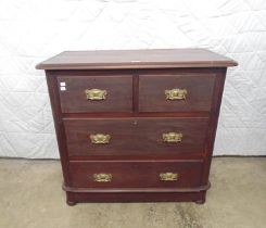 Victorian mahogany chest of two long and two short drawers with brass handles, standing on half