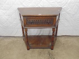 Late 20th century oak shaped two tier side table with single drawer, standing on turned legs leading