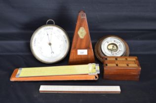 Mahogany cased metronome together with two barometers, cribbage box and two sliding rules Please