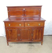 Mahogany sideboard with raised back, two drawers and three cupboard doors opening to reveal