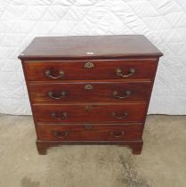 Georgian mahogany chest of drawers with four long drawers and brass handles, standing on bracket
