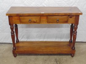Hardwood side table with two drawers supported on turned columns leading to lower tier, standing