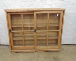 Pine bookcase with two sliding glazed doors - 46" x 12.25" x 38" high Please note descriptions are