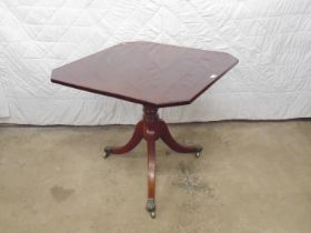 19th century mahogany tip top occasional table having cut corners and standing on turned column with