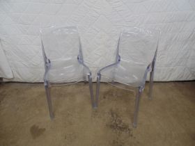 Pair of modern style moulded clear plastic chairs Please note descriptions are not condition