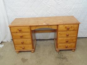 Pine dressing table with kneehole flanked by four drawers - 18" x 54" x 27.5" tall together with a
